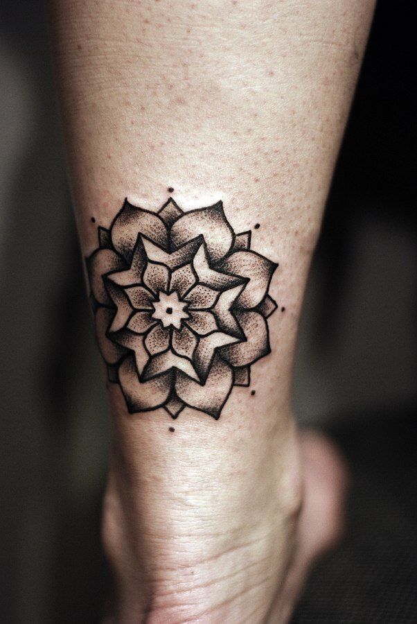 Dotwork style tattoo on the calf for women