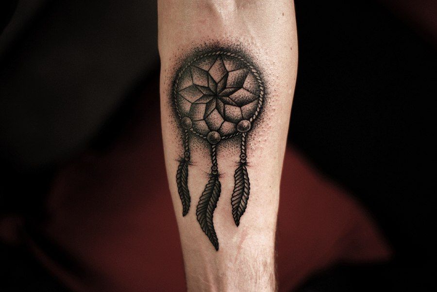 Tattoo in dotwork style on the forearm for men