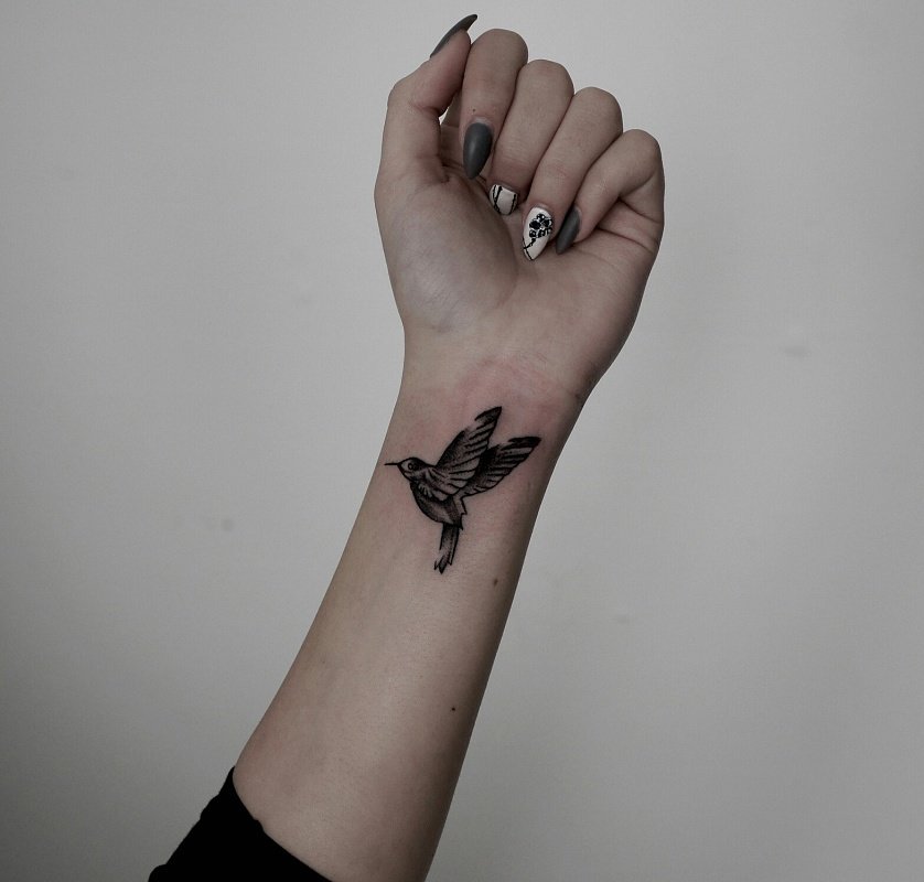 Hummingbird tattoo on the wrist for men