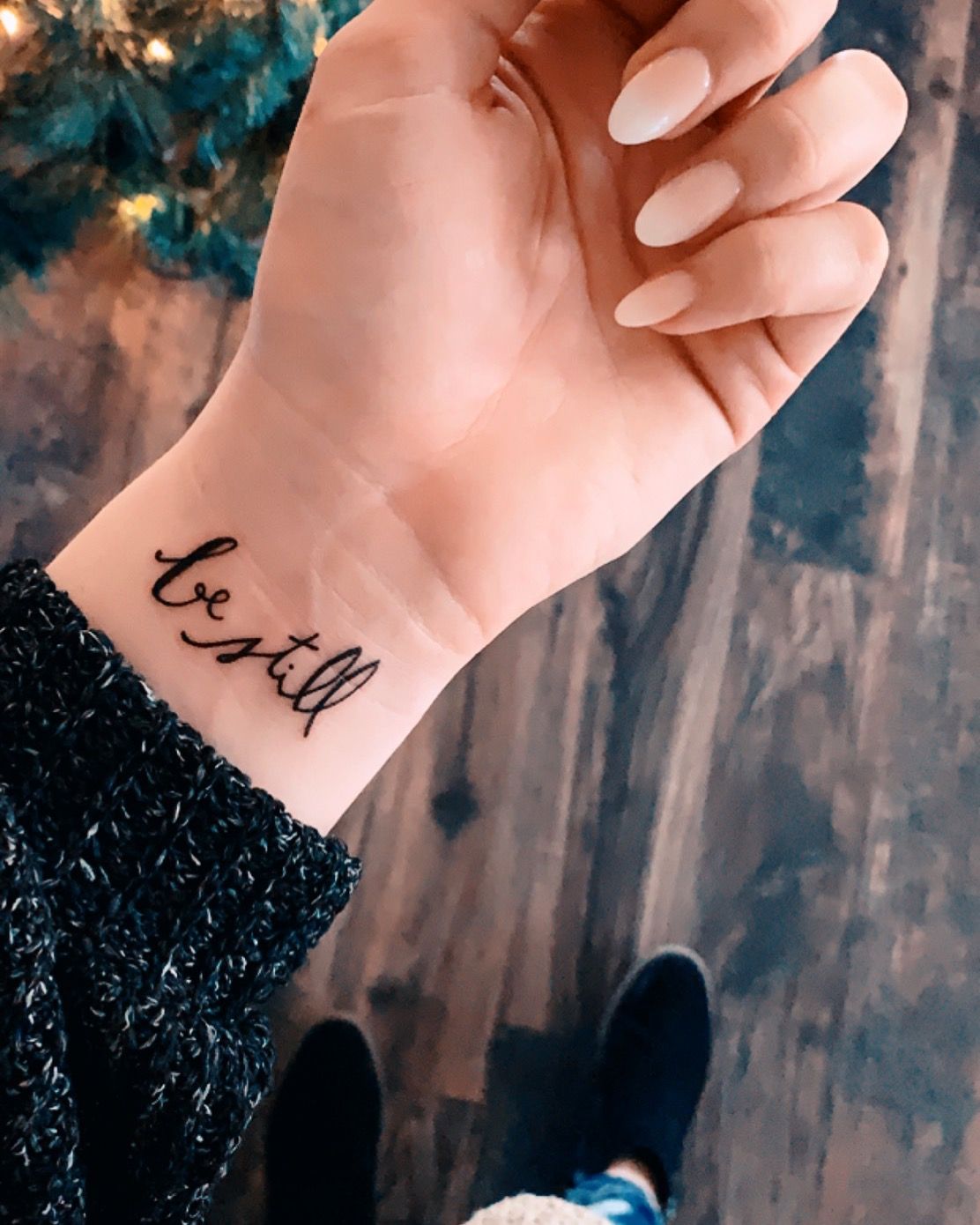 Tattoo with inscription on wrist for women