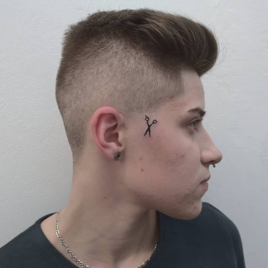 Facial scissors tattoo for men