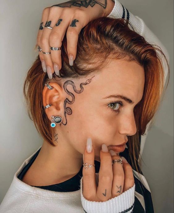 Snake tattoo on the face for women