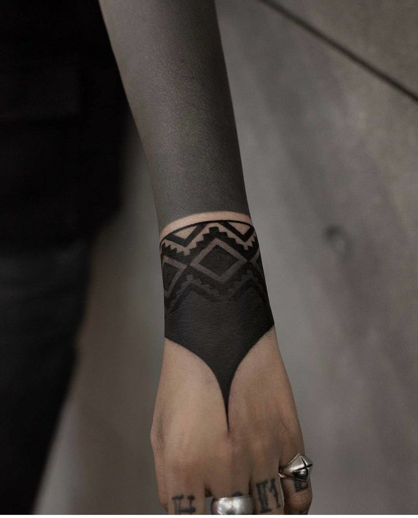 Blackwork tattoo on arm for women