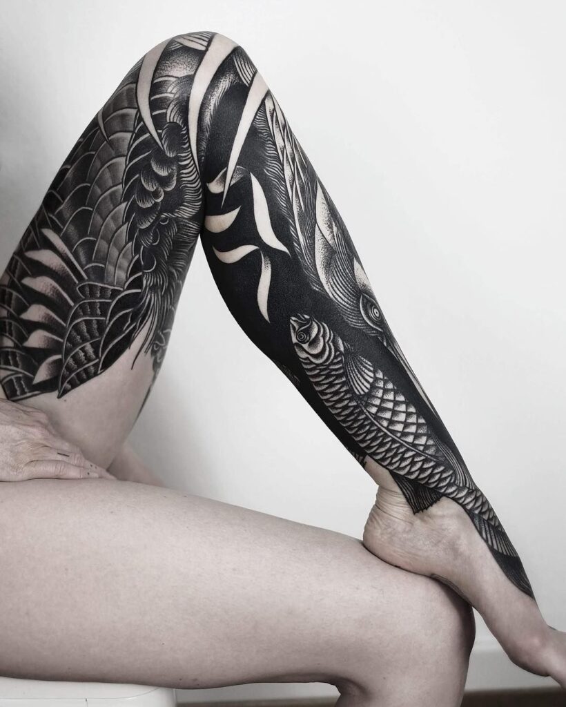 Blackwork tattoo on leg for women