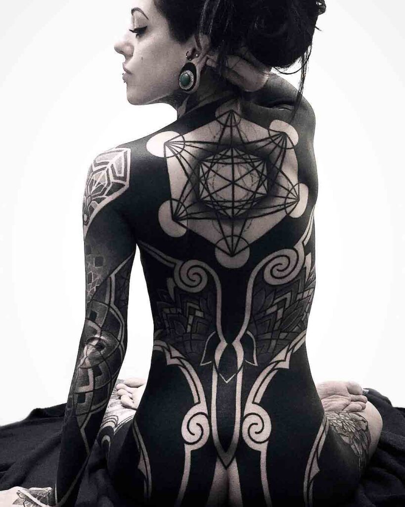 Blackwork tattoo on the back for women