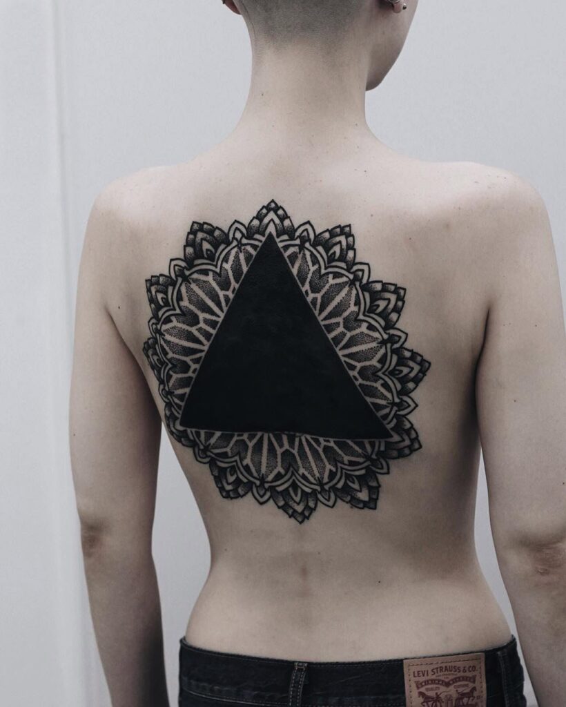 Blackwork tattoo on the back for women