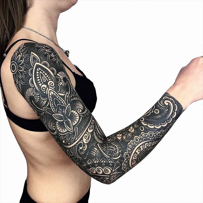 Blackwork tattoo on arm for women