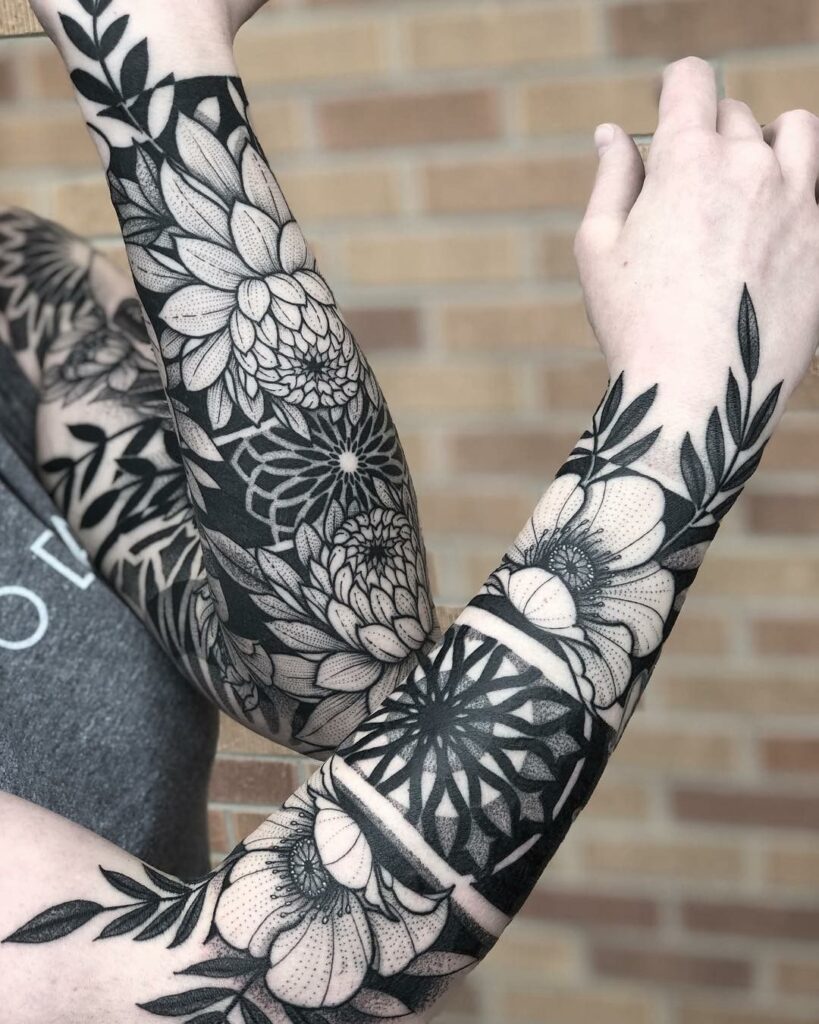 Blackwork tattoo on the arm for women