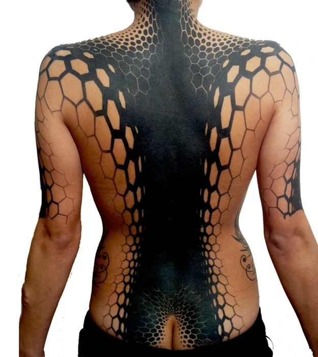 Blackwork tattoo on the back for women