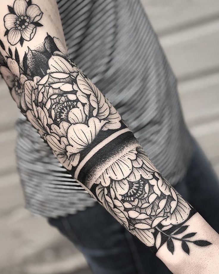 Blackwork tattoo on arm for women