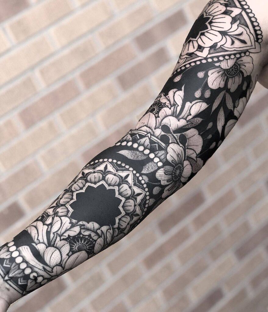 Blackwork tattoo on arm for women