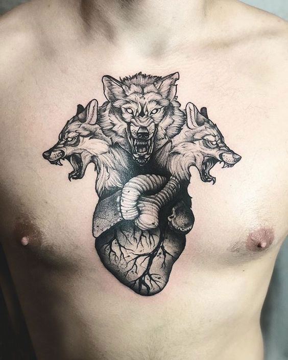 Cerberus and heart tattoo on the chest for men