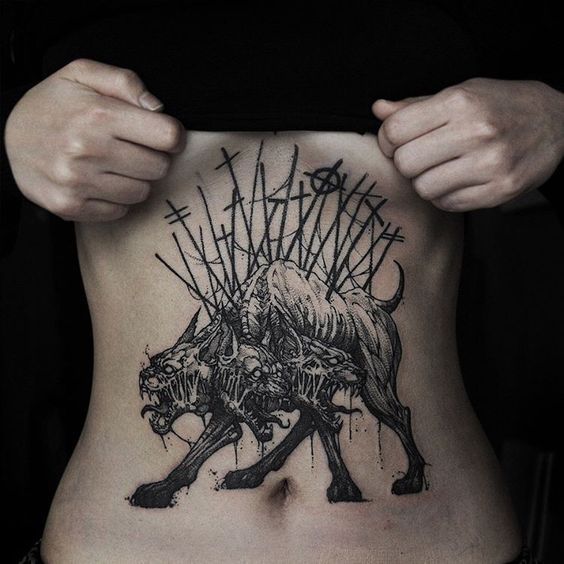 Cerberus tattoo on the abdomen for women