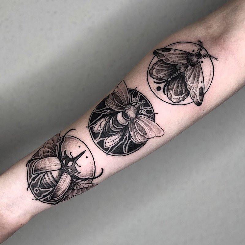 Graphic style tattoo on forearm for men