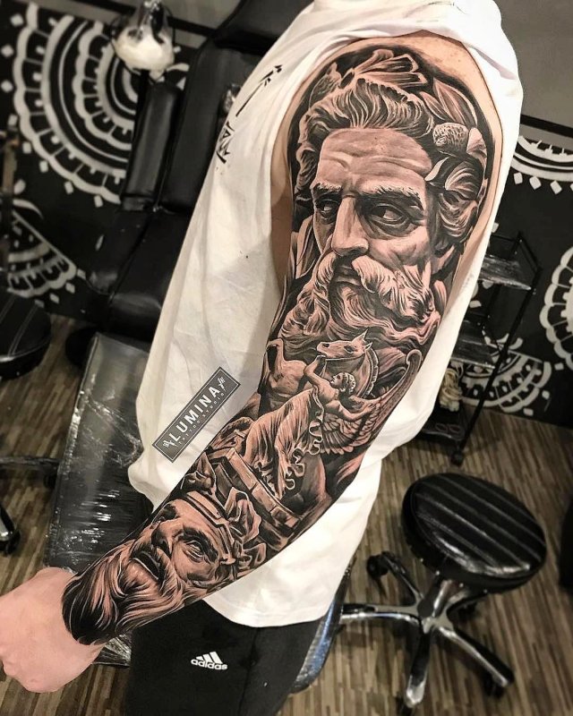 Large greek-style tattoo on the arm for men