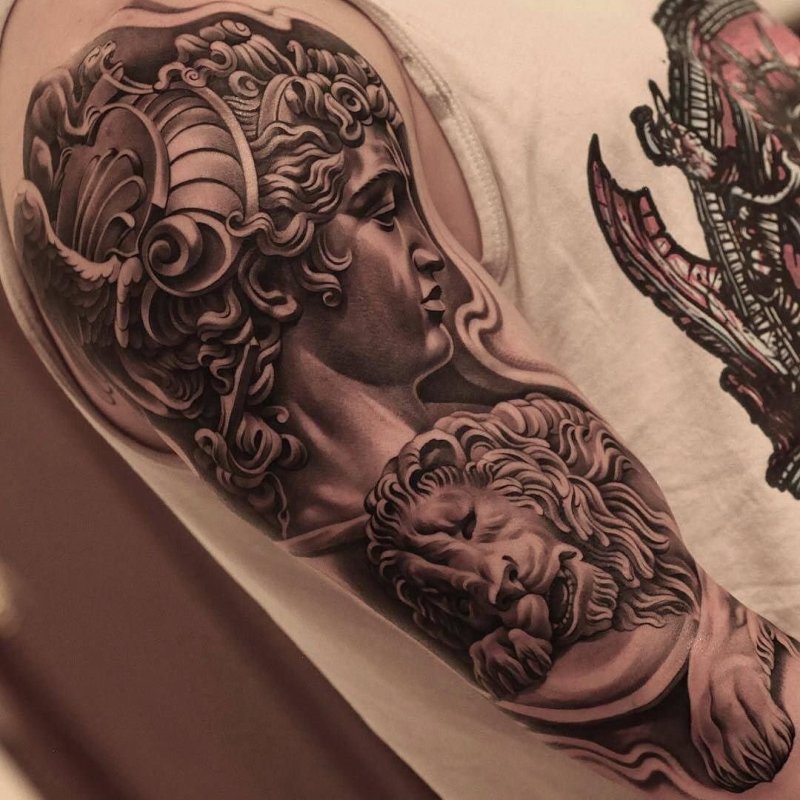 Large greek-style tattoo on the arm for men