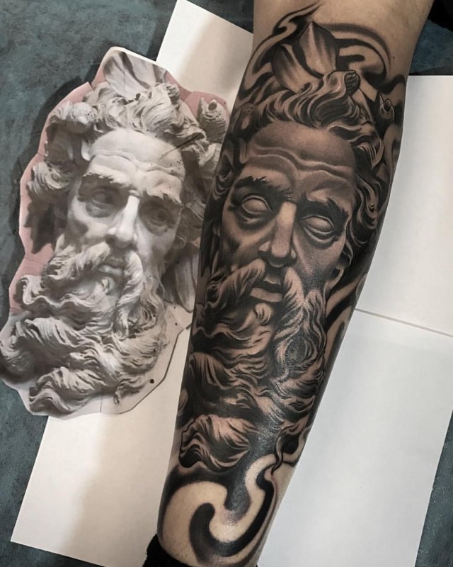 Greek-style tattoo on the arm for men