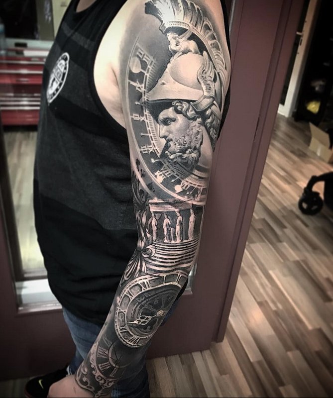 Large greek-style tattoo on the arm for men