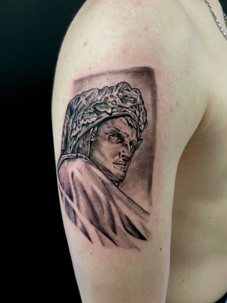 Greek-style tattoo on the shoulder for men