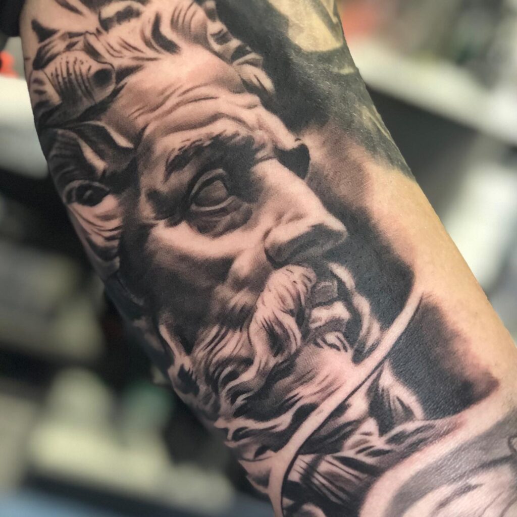 Greek-style tattoo on the arm for men