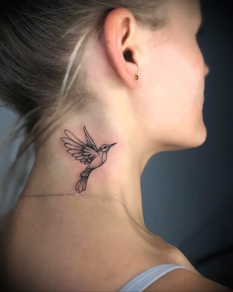 Birds tattooed on the neck for women