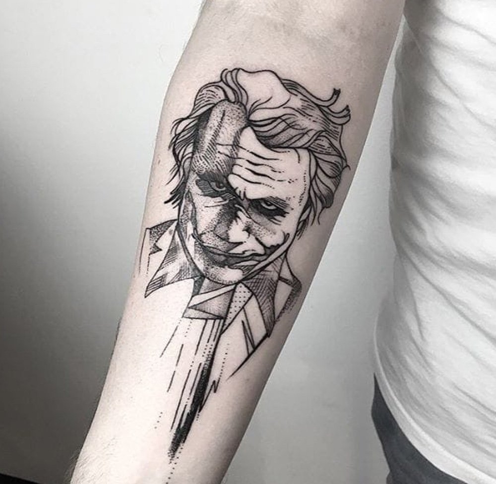 Large joker tattoo on the forearm for men