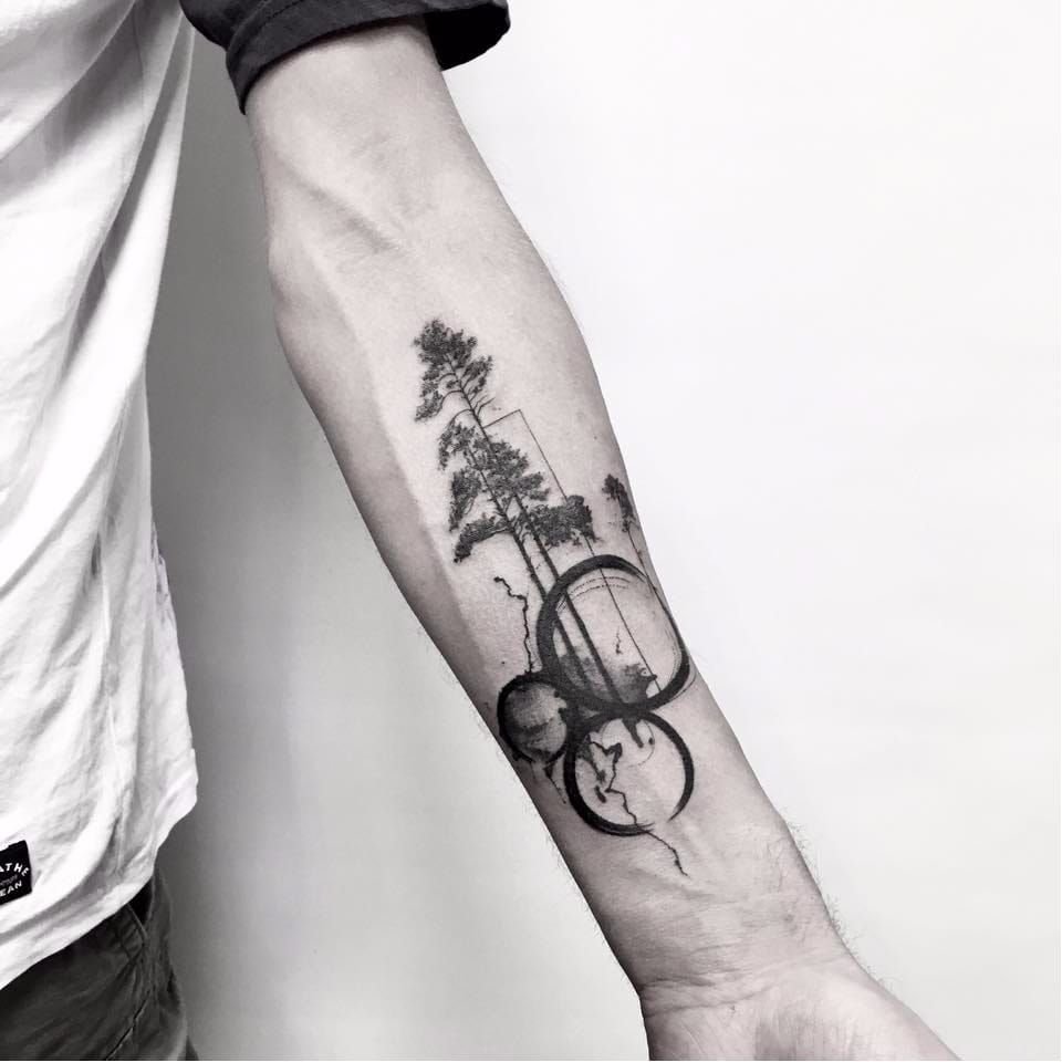 Large tree tattoo on the forearm for men