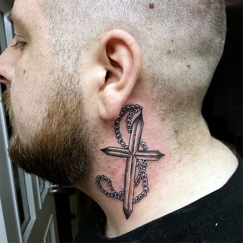 Cross tattoo on the neck for men