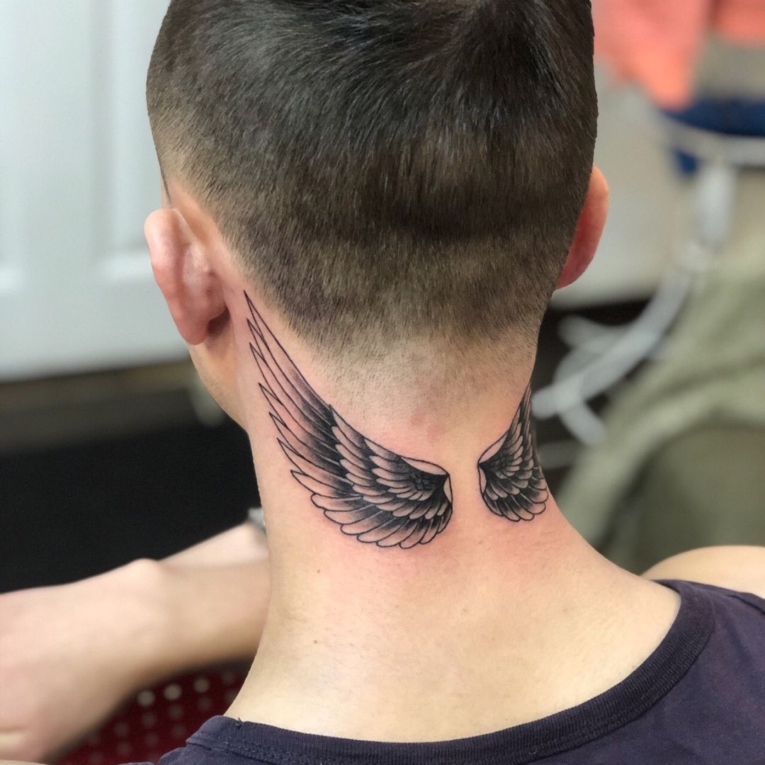 Tattoo of wings on the neck for men