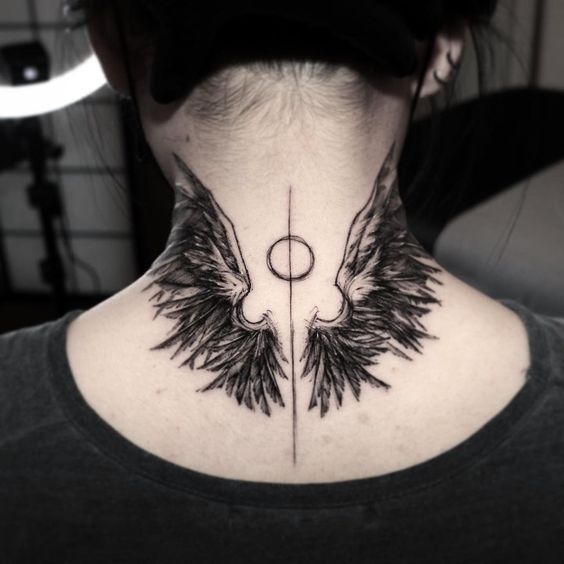 Tattoo of wings on the neck for women