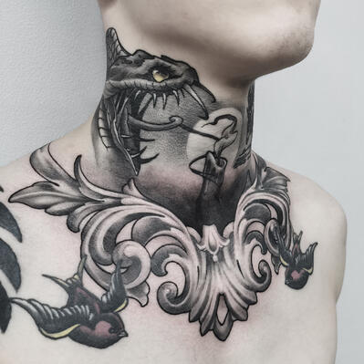 Large dragon tattoo on the neck for men