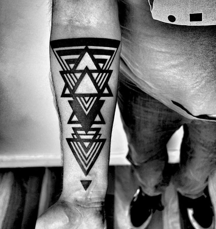 Black work style tattoo on the forearm for men