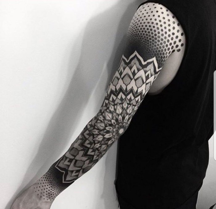 Blackwork tattoo on the arm for men