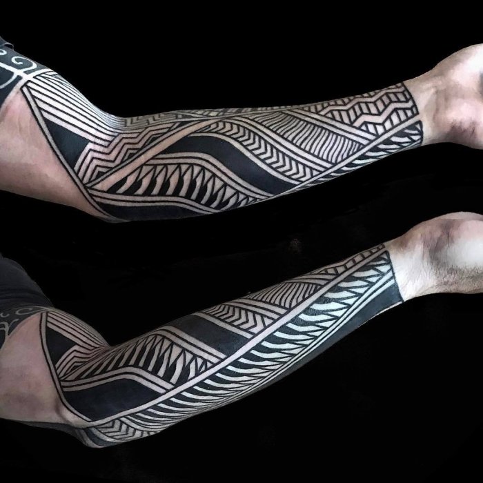 Blackwork tattoo on the forearm for men