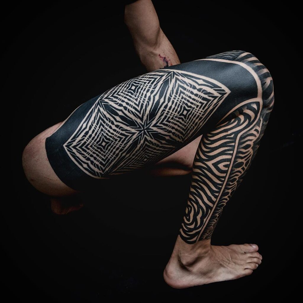 Blackwork tattoo on the leg for men