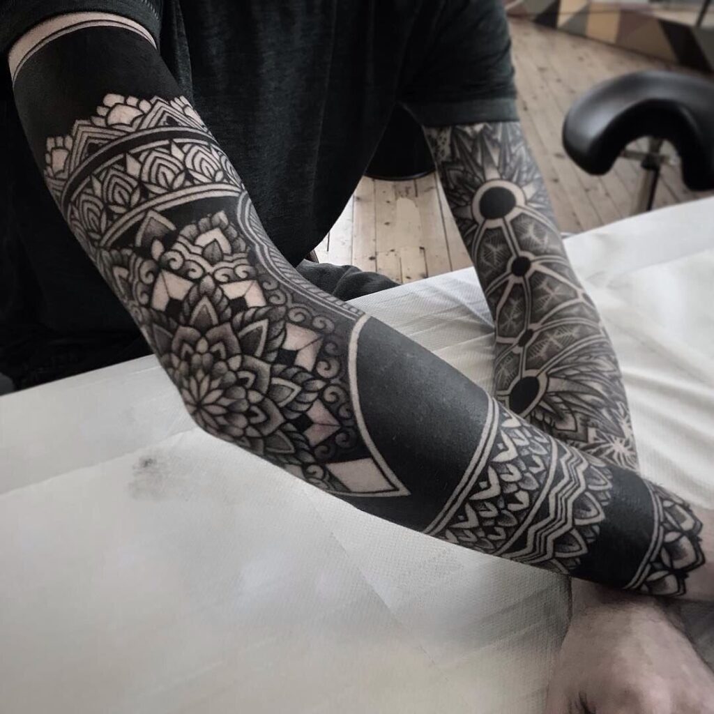 Blackwork tattoo on the arm for men