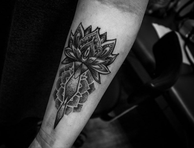 Large blackwork style lotus tattoo on the forearm for men