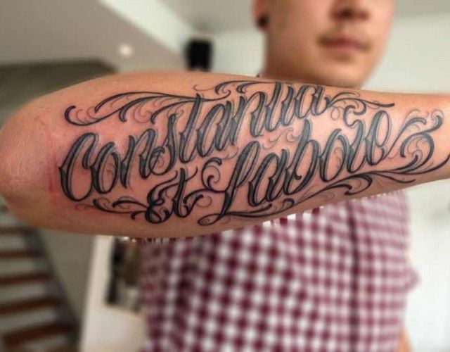 Calligraphy tattoo on forearm for men