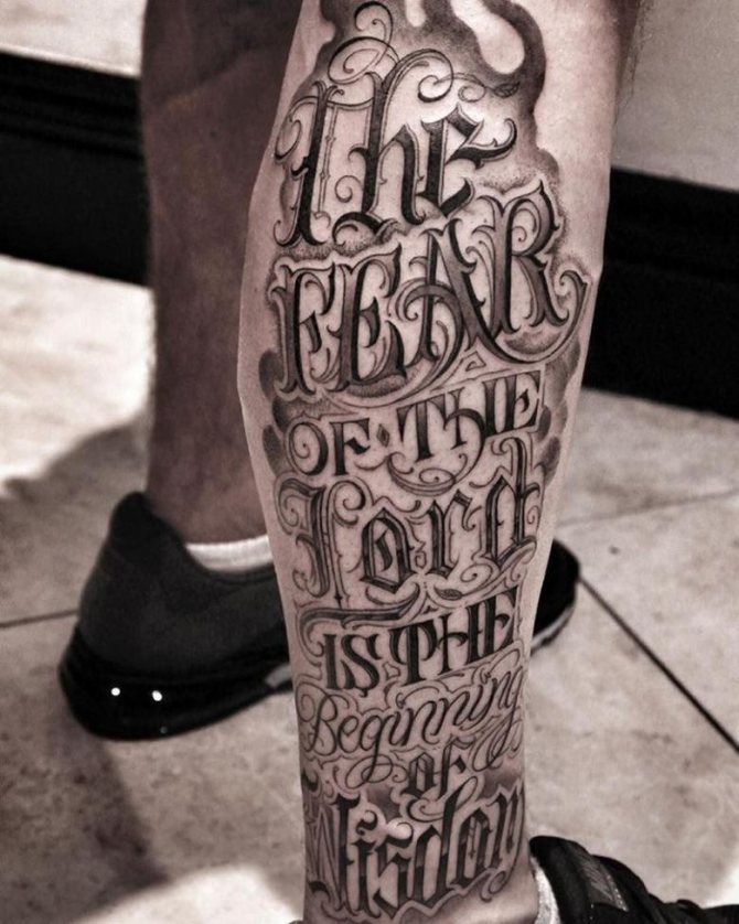 Calligraphy style tattoo on the shin for men