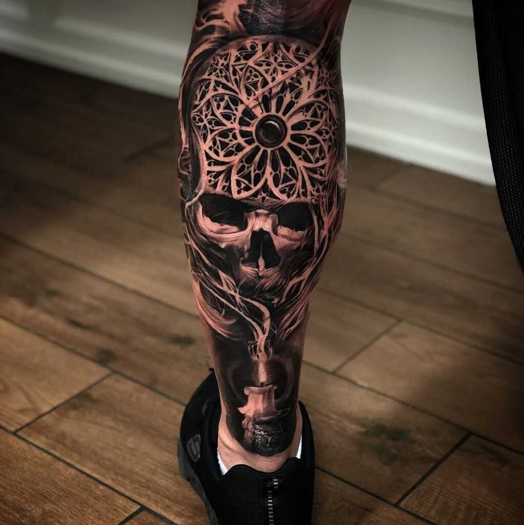 Large skull tattoo on the calf for men