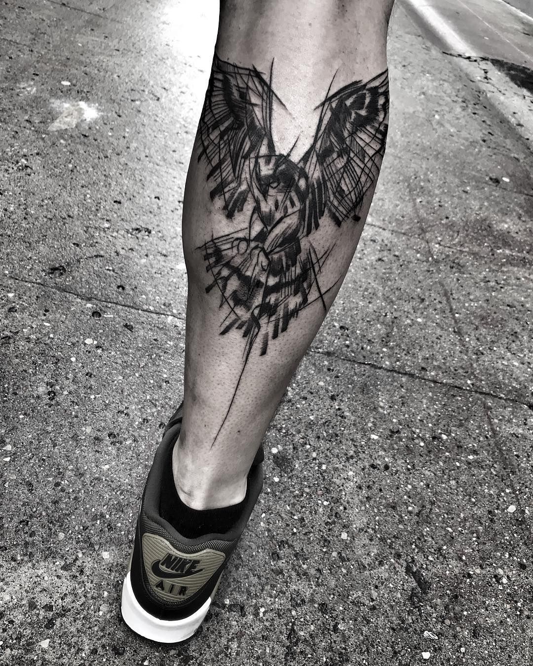 Tattoo of an owl on a calf for men