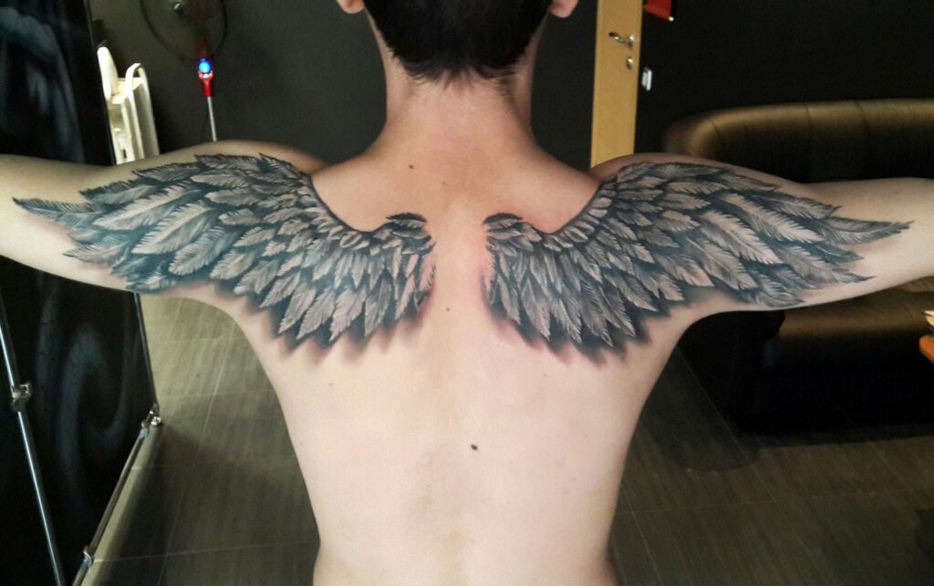 Tattoo of wings on the back for men