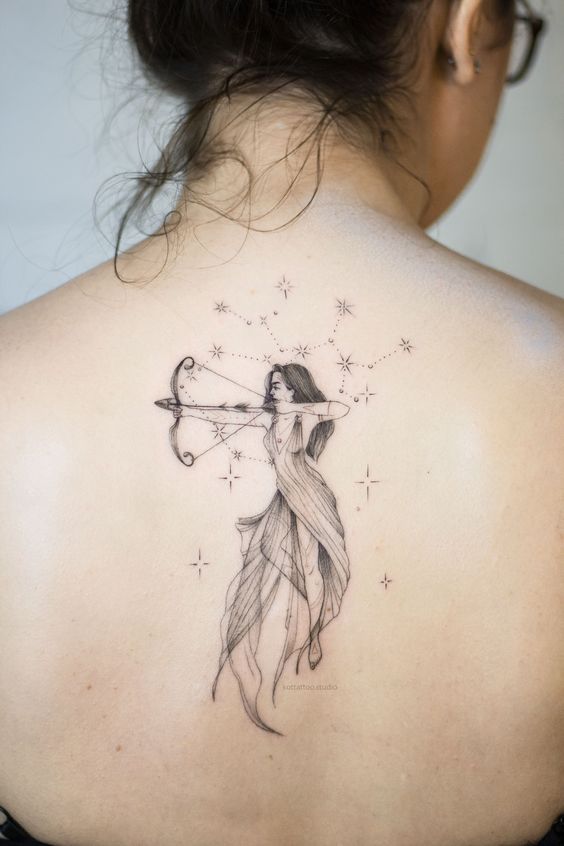 Tattoo of the zodiac sign of sagittarius on the back for women