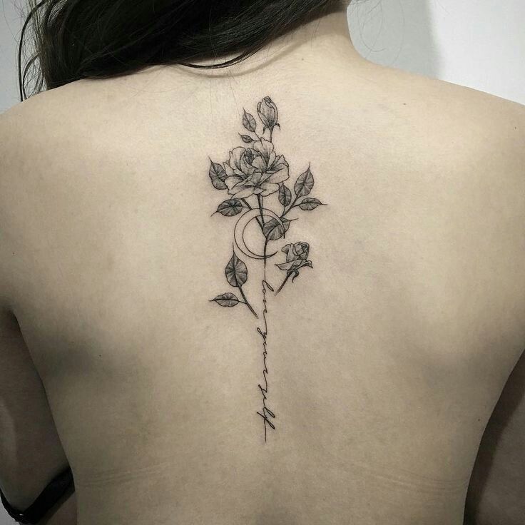 Rose and moon tattoo on the back for women