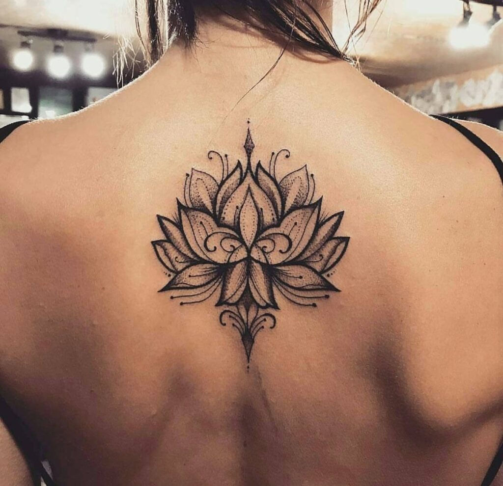 Lotus tattoo on the back for women