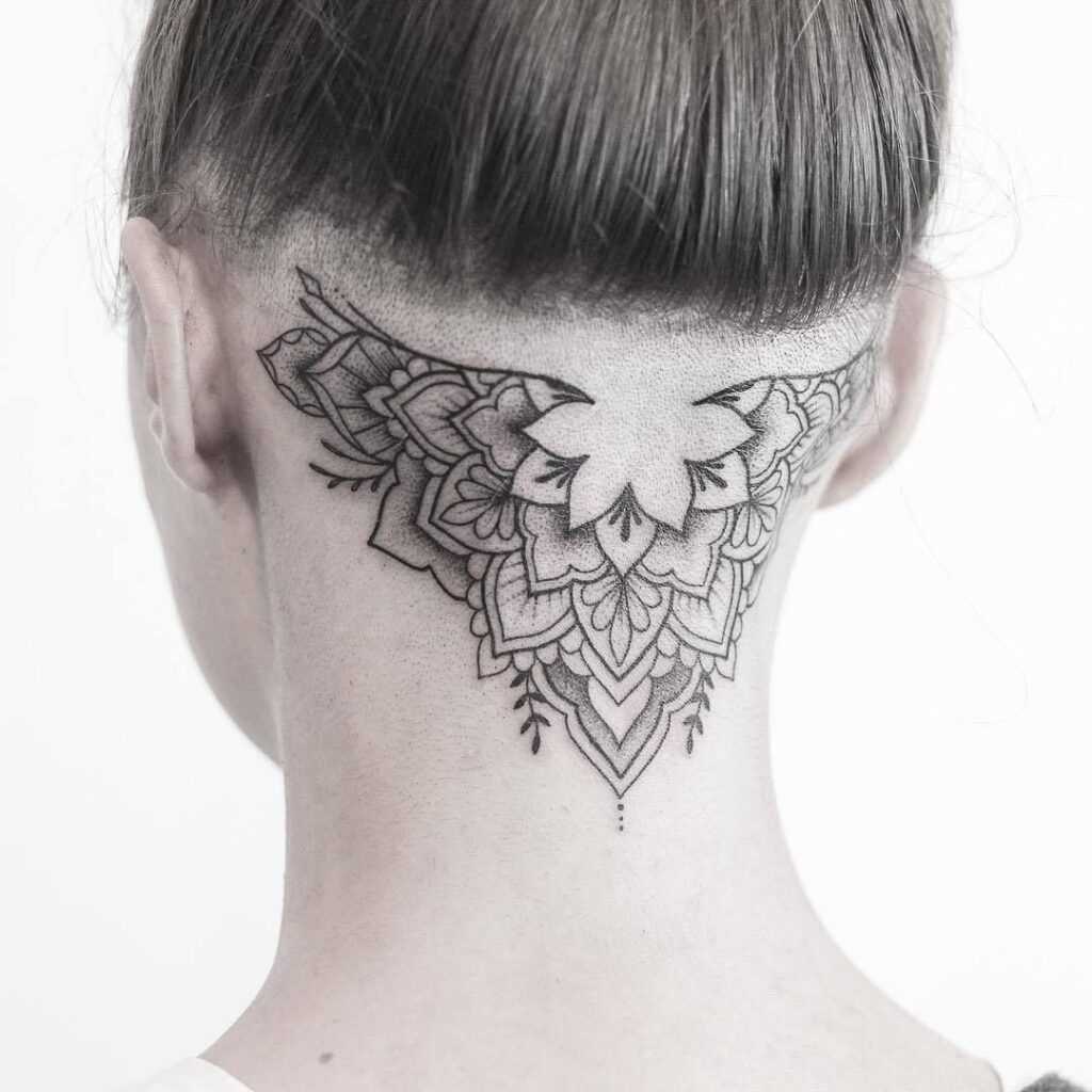 Large tattoo on the back of the head for women