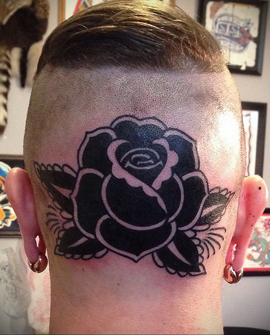 Large rose tattoo on the back of the head for men