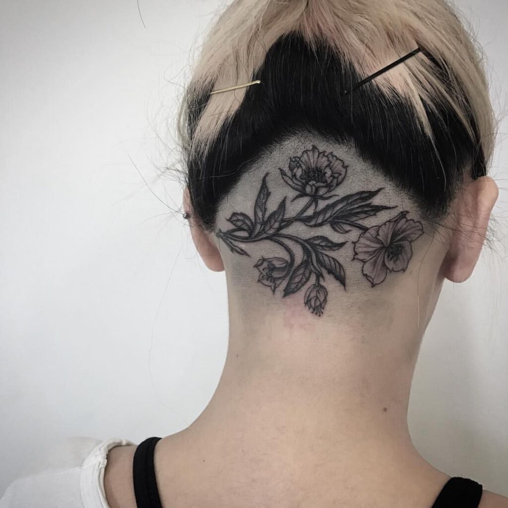 Flower tattoo on the back of the head for women