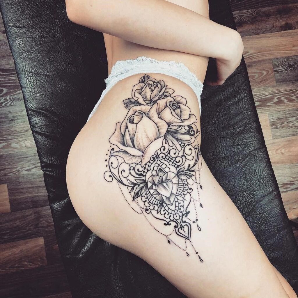 Flower tattoo on the hip for women