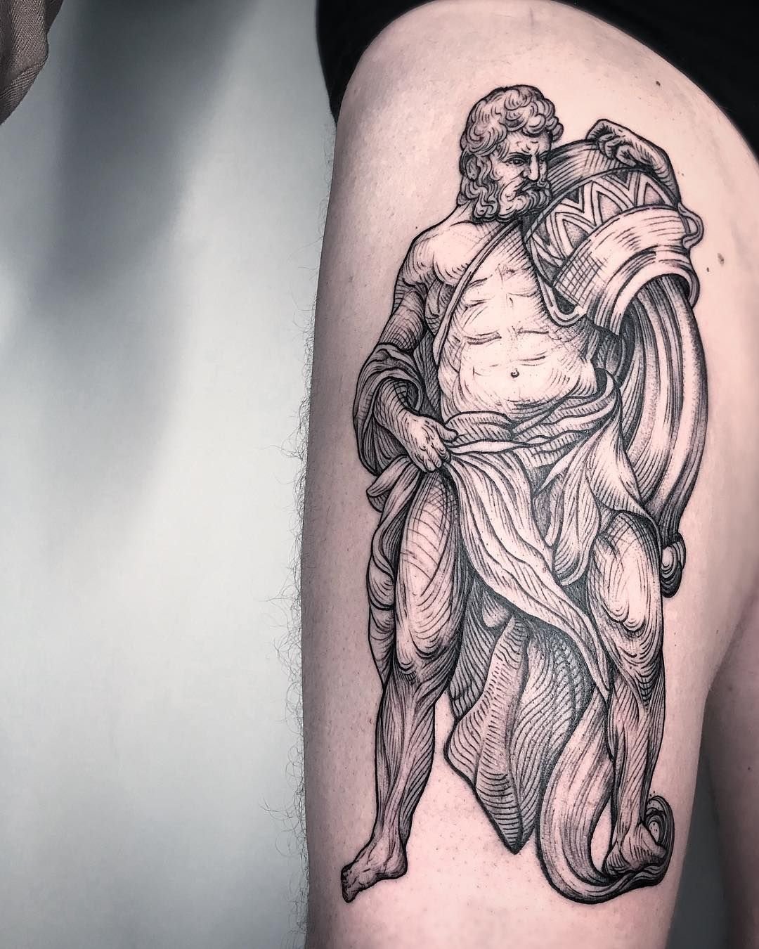 Large tattoo on the thigh for men